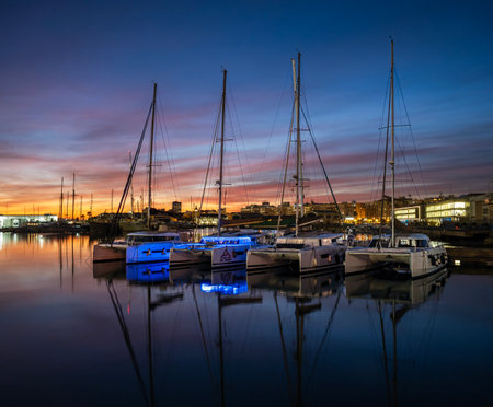 Yachts and boats moored in the marina at sunset