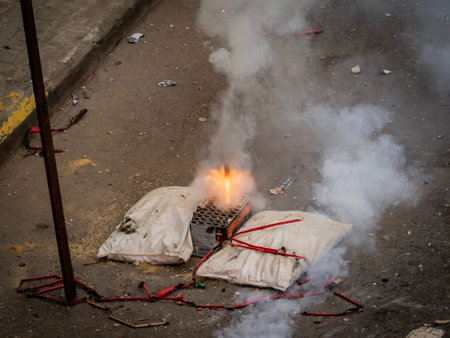 A man burns a candle in Kolkata.
