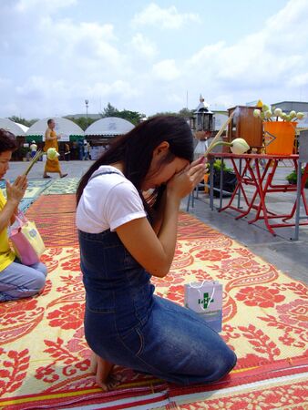 BANGKOK, THAILAND - APRIL 03: Thai people worship a Buddhist shrine at a Buddhist festival in Suan Luang. April 03 2007 in Bangkok. のeditorial素材