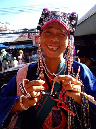 BANGKOK, THAILAND -SEPTEMBER 23: Thai hill tribe woman sells jewelery to tourists at Khaosarn road September 23, 2007 in Bangkok. のeditorial素材