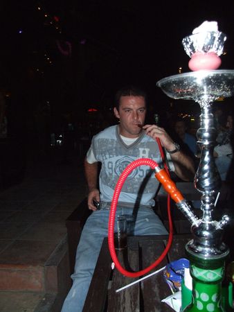 KOH SAMUI, THAILAND - MARCH 7: Caucasian man smokes a Arabic pipe in a bar on March 7, 2007 in Koh Samui. のeditorial素材
