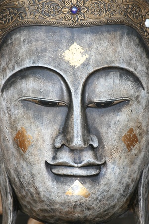 Metal Buddha face ornament, Bangkok, Thailand. の写真素材