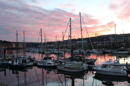 Sunset Over Whitby Harbour, Yorkshire, England の写真素材