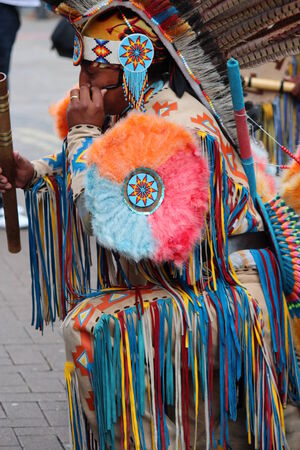 Aztec/ Maya Busker in Traditional Dress, England.