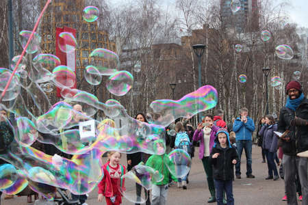 Giant Rainbow Bubbles Entertain Crowd, London, England.のeditorial素材
