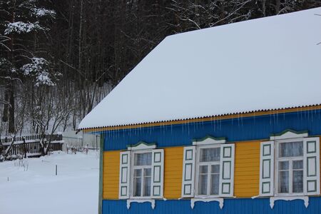 Blue Russian House With Shutters In Winter.のeditorial素材