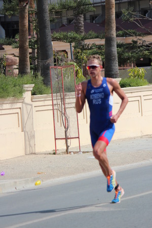 Editorial: Runner Completing Final Stage of Ayia Napa Triathlon, Nissi Beach, Cyprus; Sunday 3rd April 2016.のeditorial素材