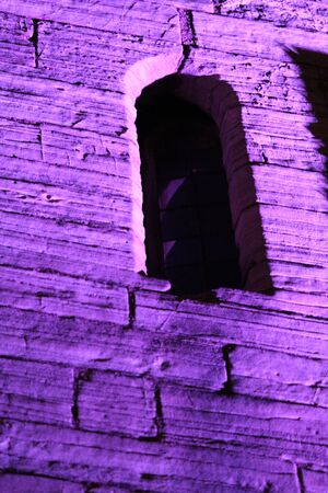 Purple Floodlit Medieval Stone Wall.の写真素材
