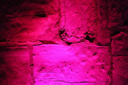 Rainbow Floodlighting on Medieval Stone Building.の写真素材