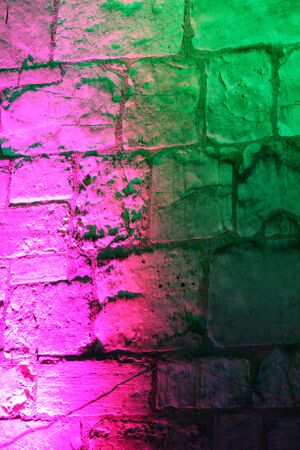 Rainbow Floodlighting on Medieval Stone Building.の写真素材