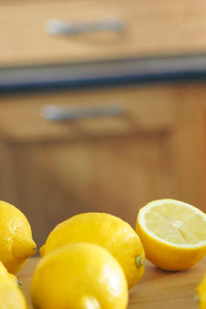 Fresh lemons on a kitchen worktopの写真素材