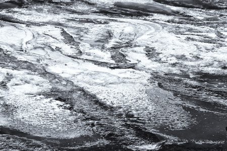 Ice on partially frozen river surfaceの写真素材