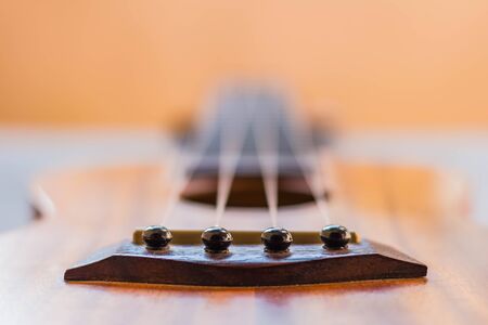 Close up of ukulele on tableの写真素材