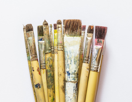 Paintbrushes on white paperの写真素材