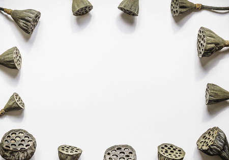 Dry lotus with white paper on wooden table backgroundの写真素材