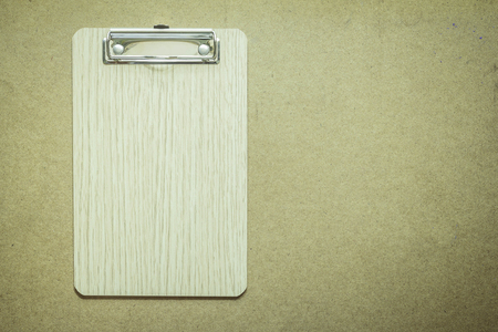 Clipboard on wooden table topの写真素材