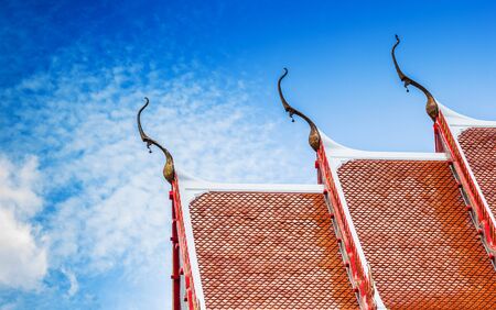 The Beautiful roof of temple in thailand with blue sky background.の写真素材