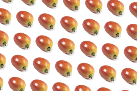 Pattern fresh tomatoes isolated on white background.