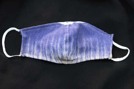 DIY fabric cotton protective masks on black background. Concept for protect from...