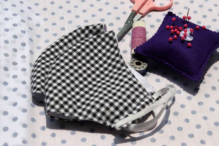 Sewing DIY cloth face masks to prevent the spread of covid-19 virus (Coronavirus) and air pollution pm2.5.  Best DIY projects & easy can do it by yourself at home.の写真素材