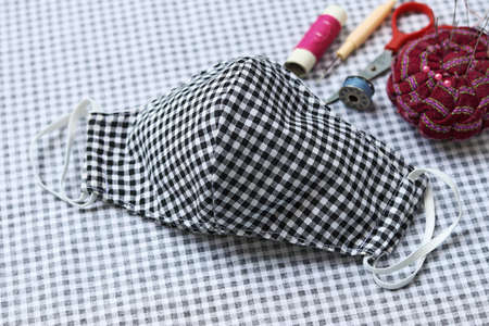 Sewing DIY cloth face masks to prevent the spread of covid-19 virus (Coronavirus) and air pollution...
