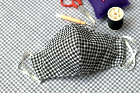 Sewing DIY cloth face masks to prevent the spread of covid-19 virus (Coronavirus) and air pollution pm2.5.  Best DIY projects & easy can do it by yourself at home.の写真素材