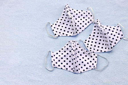 Sewing face protective masks handmade from fabric cloth to prevent the spread of covid-19 virus (Coronavirus) and air pollution pm2.5. Best DIY projects & easy can do it by yourself at home.の写真素材