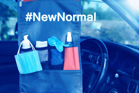 Word of New Normal in travel concept after Covid-19 / Coronavirus pandemic. Hanging bag in car...