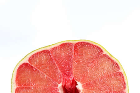 Grapefruit ruby of Siam or fresh red pomelo on white background, Thailand Siam ruby pomelo citrus fruit. Cross section of fruit.の写真素材