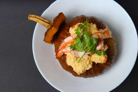 Pumpkin Steamed Egg recipe , healthy food to eat everyday. Steamed egg in whole pumpkin with shrimp and coriander leaves. Food to eat to lose weight.の写真素材