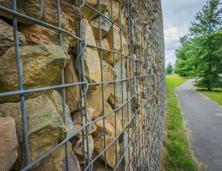 close up of basket filled with stones with road texture backgroundの写真素材