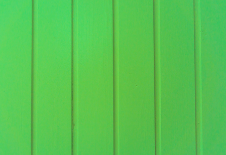 green painted vertical wooden planks background structureの写真素材
