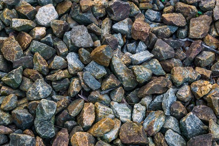 granite pebble stones ground garden decoration in many different colors and shapes macro closeup...