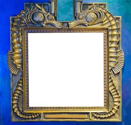 empty golden painting or mirror frame decorated with seahorse animals to put what ever you want on the empty white spaceの写真素材