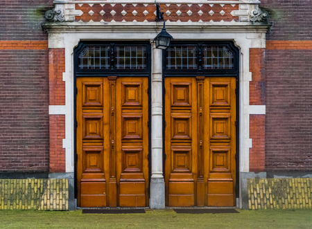 two massive wooden doors with a lantern, Modern architecture, entrance door