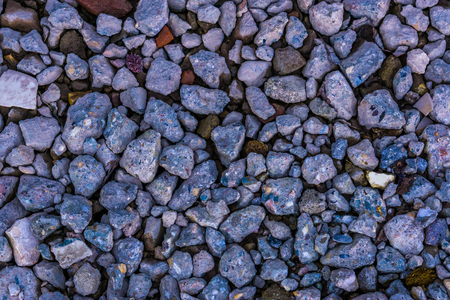 Background of many gravel stones in different shapes and sizes, garden and ground decorations