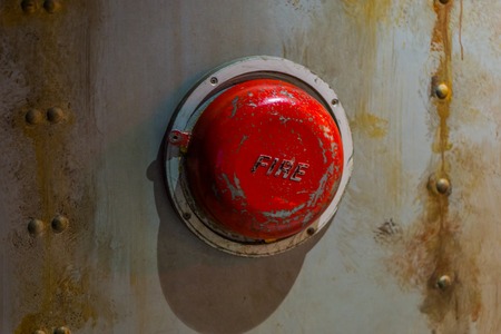 Old alarm systems, Classic vintage fire alarm bell on the wall of a submarineの写真素材