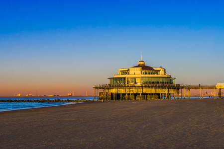the well known pier jetty of Blankenberge beach, Beglium, Beautiful coast with blue water and a colorful sky during sunsetのeditorial素材