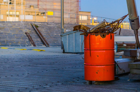 garbage can full with metal garbage, simple waste separation solutionsの写真素材