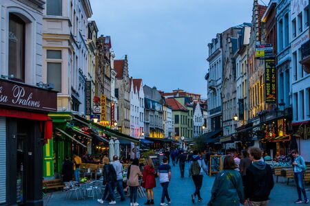 walking the crowded streets of antwerp city during night at the grotemarkt, Antwerpen, Belgium, April 23, 2019のeditorial素材