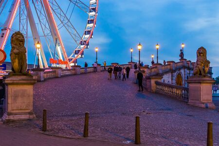 the pier in antwerp city with the view ferris wheel lighted at night, popular city architecture, Antwerpen, Belgium, April 23, 2019のeditorial素材