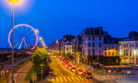 the city streets at the flemish quay of antwerp city lighted by night, Cars on the road, antwerpen, Belgium, april 23, 2019のeditorial素材