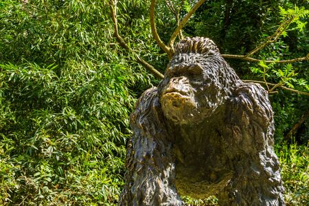 massive gorilla statue in a tropical garden, decorative animal sculptures
