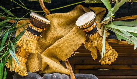 traditional african djembe drums hanging on the roof, cultural instruments of Africa, music backgroundの写真素材