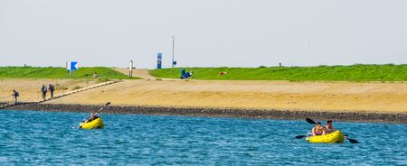 two boats water rafitng at the beach of tholen, Bergse diepsluis, Oesterdam, The netherlands, 22 april, 2019のeditorial素材