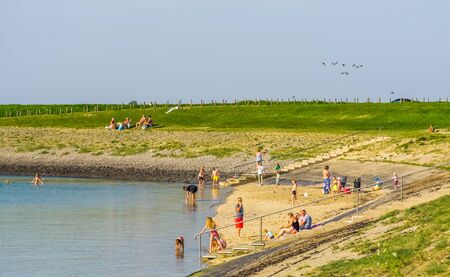 visitors of bergse diepsluis during summer season, popular beach in Tholen, Oesterdam, The netherlands, 22 April, 2019のeditorial素材