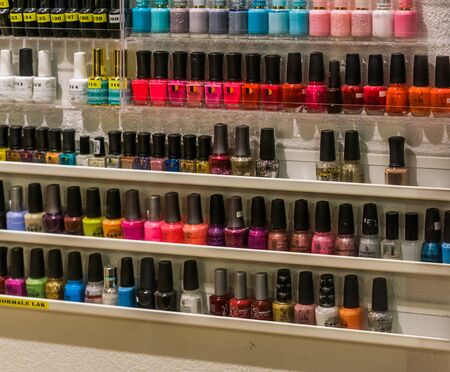 cosmetic shop display filled with bottles of nail polish, 12 february, 2019, Amersfoort, The netherlandsのeditorial素材