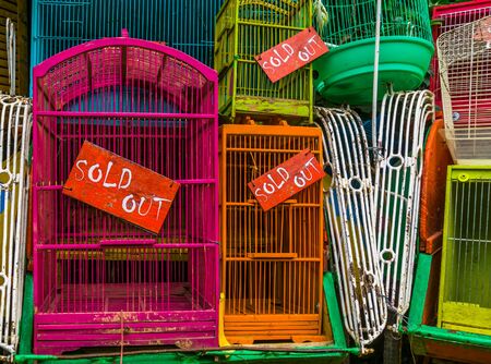 bird cages with sold out signs in closeup, Pet trade in Asia, Animal business backgroundの写真素材