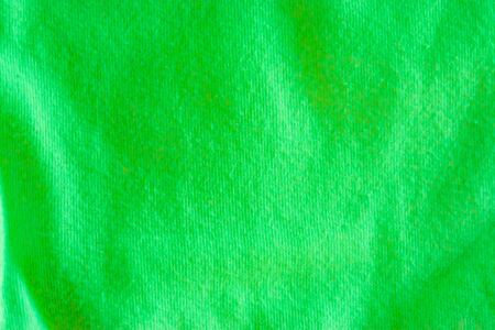Modern apple green cotton fabric in macro closeup, popular material for clothesの写真素材