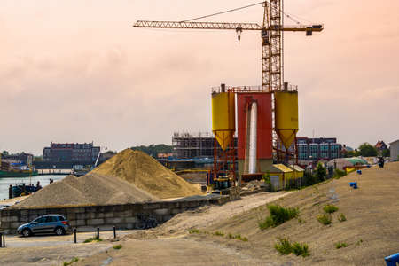 Building site with concrete equipment and construction crane, Breskens, The netherlands, 20 July, 2020のeditorial素材